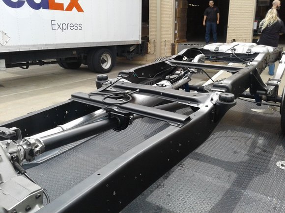 Bare frame showing clean chassis rails and suspension mounts