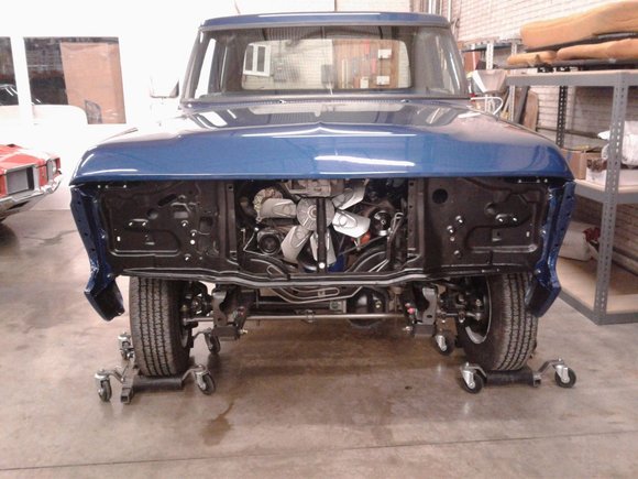 Rear view during final assembly showing tailgate and frame details