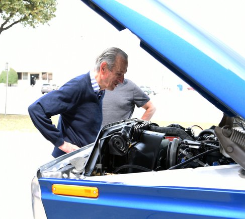Fred inspecting the detailed engine bay of his restored truck